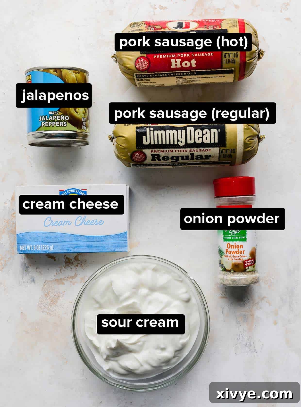Ingredients used to make cream cheese sausage dip on a white background.