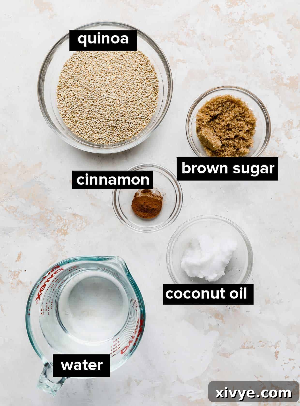 Wholesome Quinoa Porridge 3 Ingredients used to make breakfast quinoa on a white background.