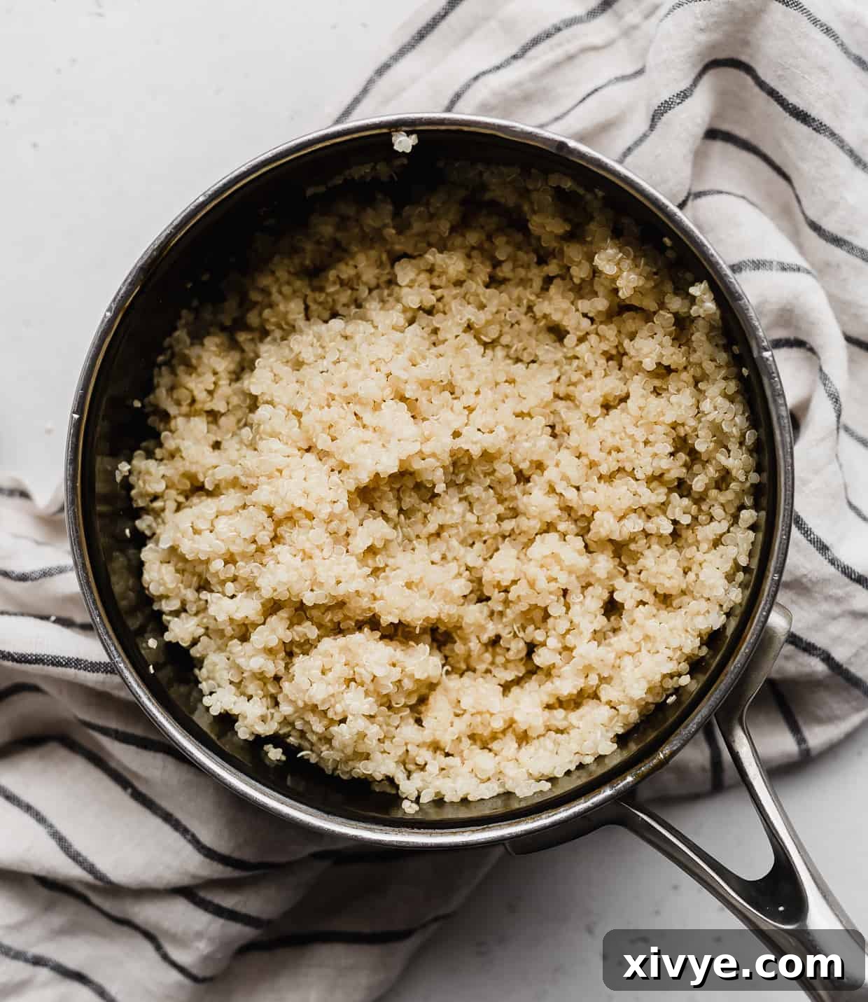 A small pot full of cooked quinoa.