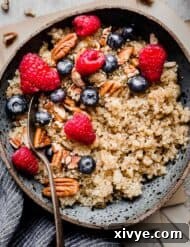 Finished Quinoa Oatmeal in a bowl with toppings.
