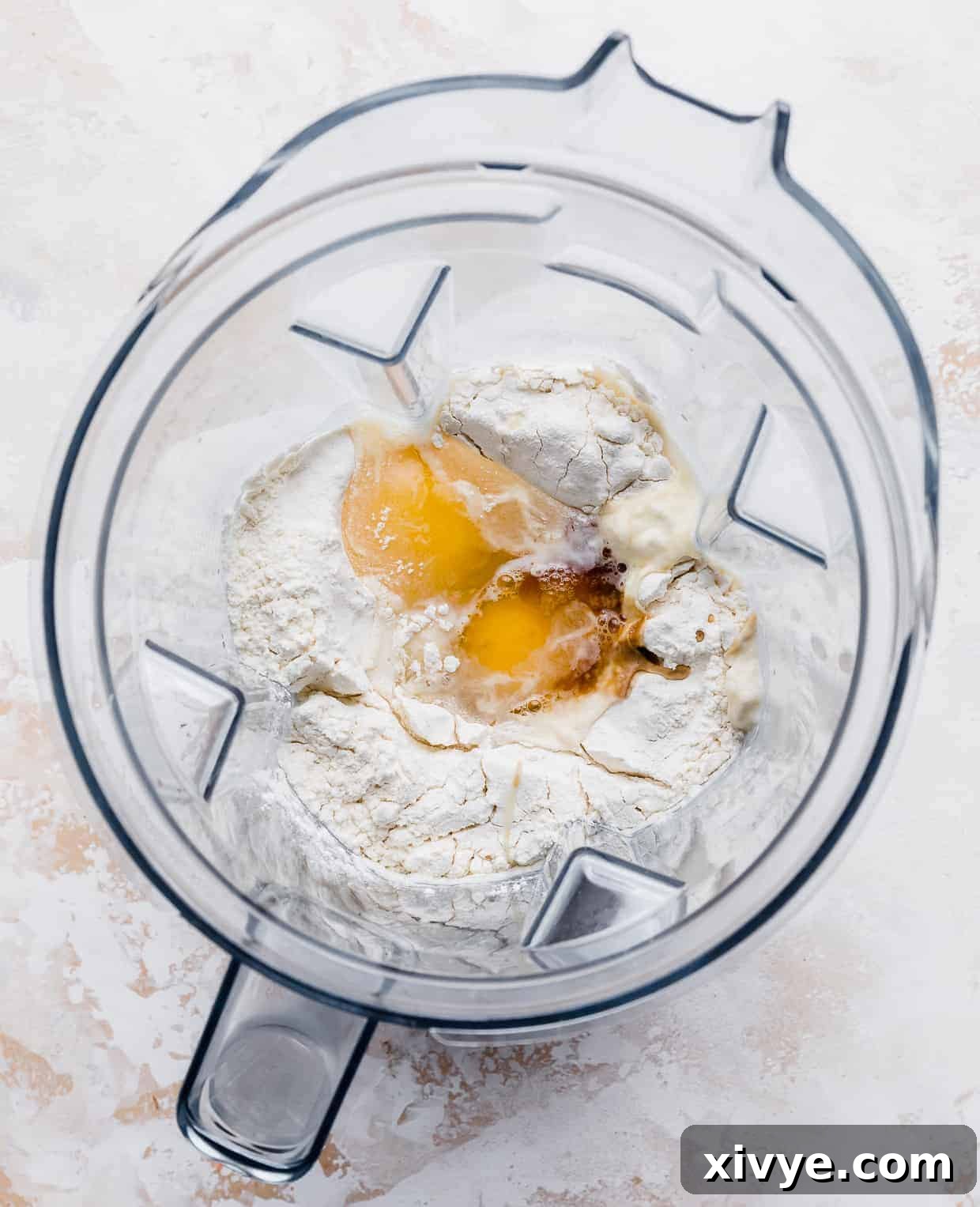 Eggs, flour, milk, and vanilla in a blender.