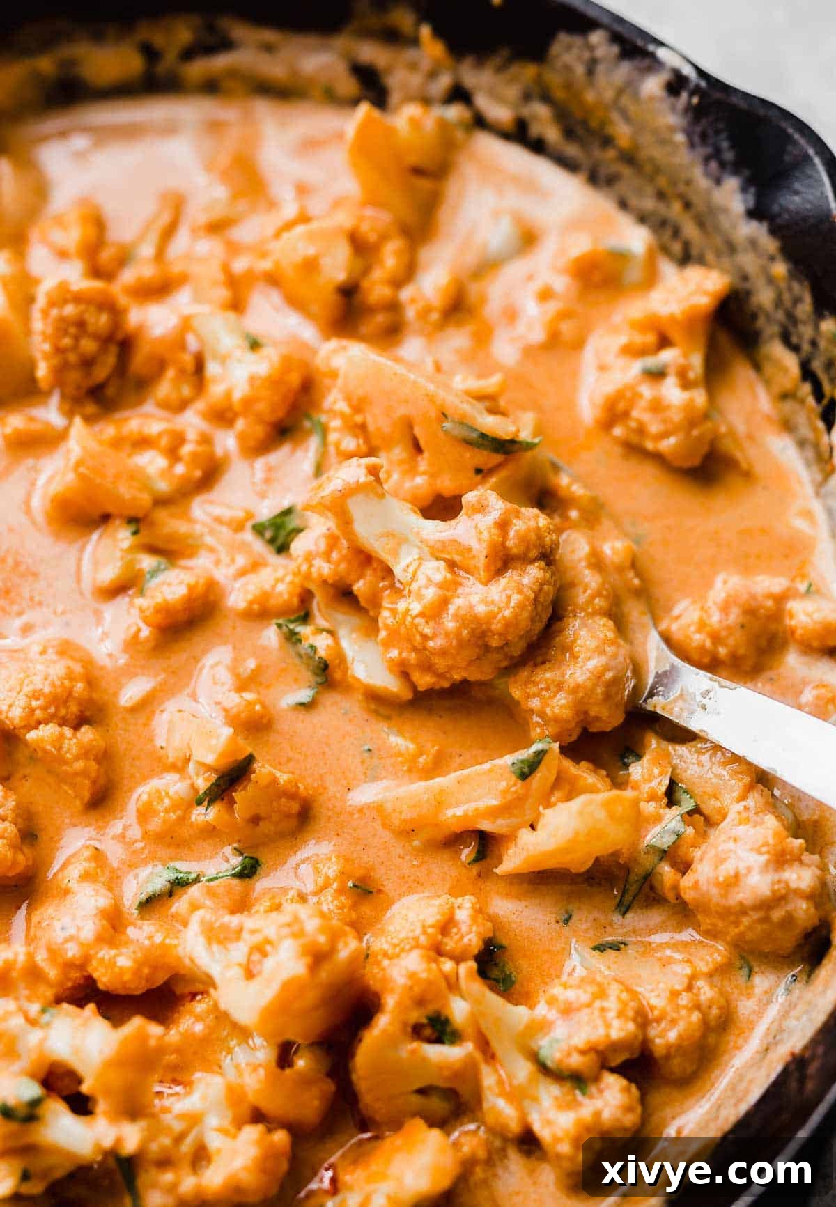 Close up photo of Indian Butter Cauliflower in a black skillet.