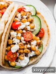 Mediterranean Chickpea Gyros 7 Chickpea Gyros topped with feta, tomatoes, and cucumbers.