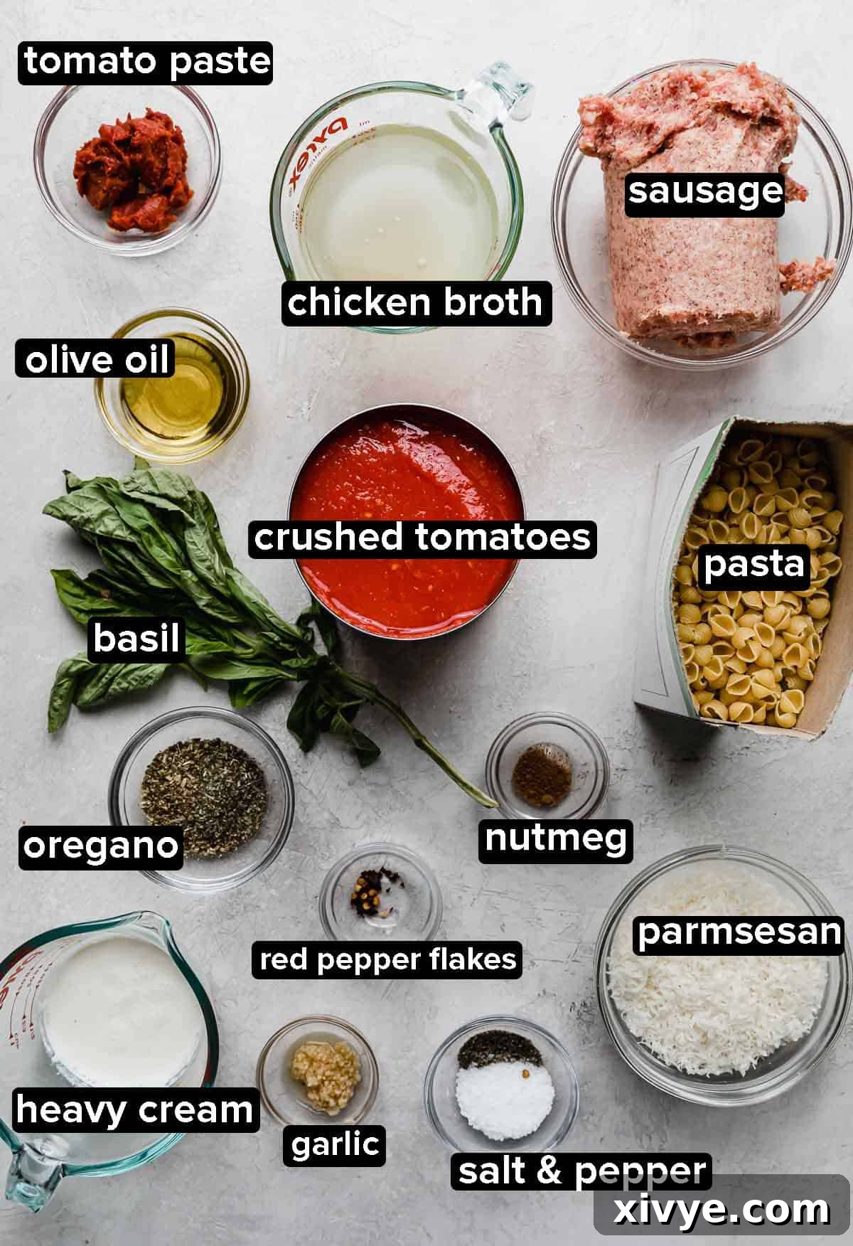 Classic Bolognese Ragù 3 The Best Bolognese Sauce ingredients portioned into glass bowls on a light gray background.