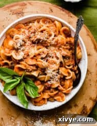 Classic Bolognese Ragù 7 A white pasta bowl filled with the Best Bolognese Sauce and noodles.