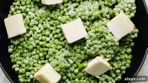Elevate Your Frozen Peas 9 Frozen peas, cubed butter, sugar, and minced garlic in a skillet, ready to be cooked.