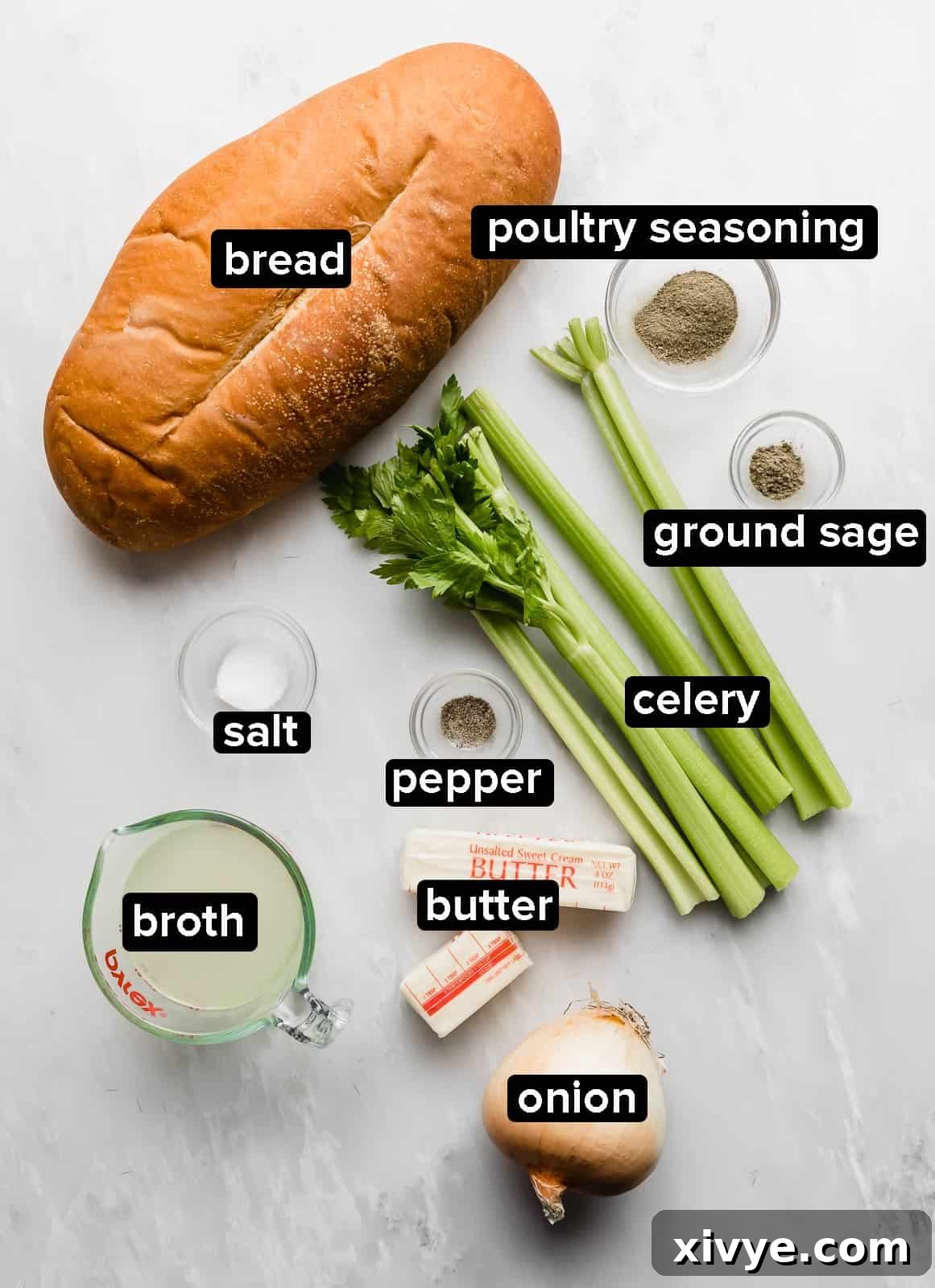 The Ultimate Thanksgiving Stuffing 3 Ingredients used to make homemade thanksgiving stuffing on a marble counter.