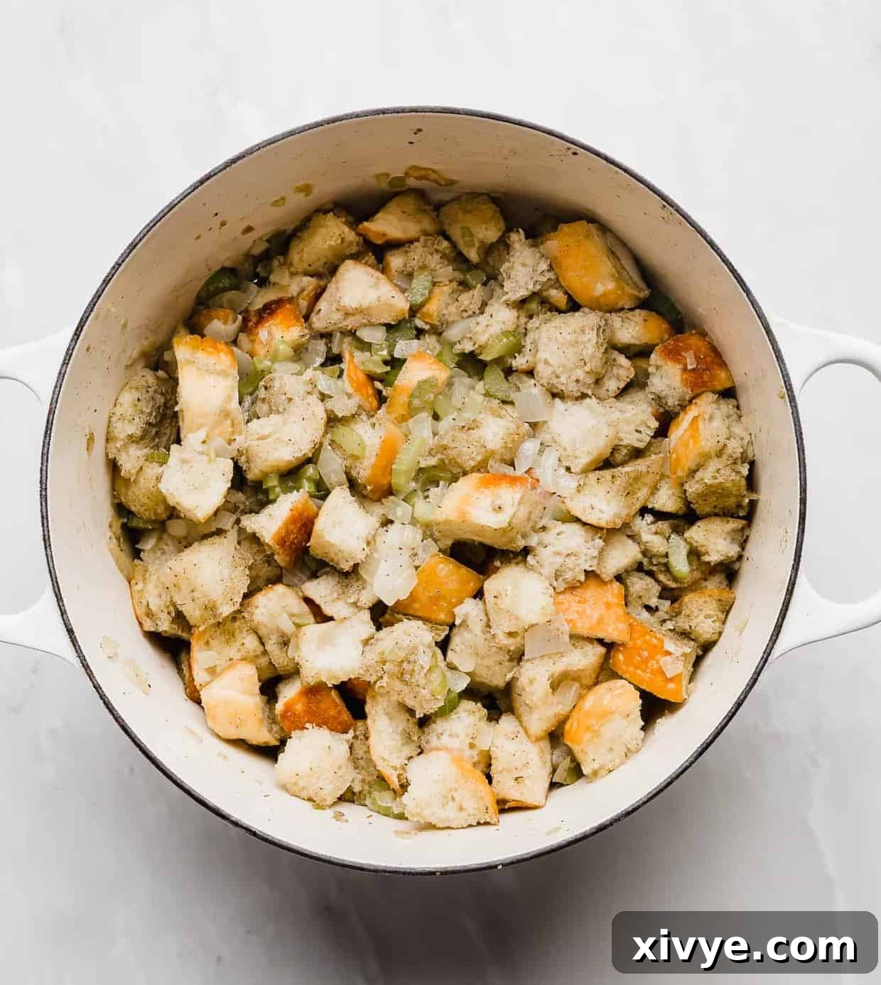 The Ultimate Thanksgiving Stuffing 6 Cubed bread in a large dutch oven.