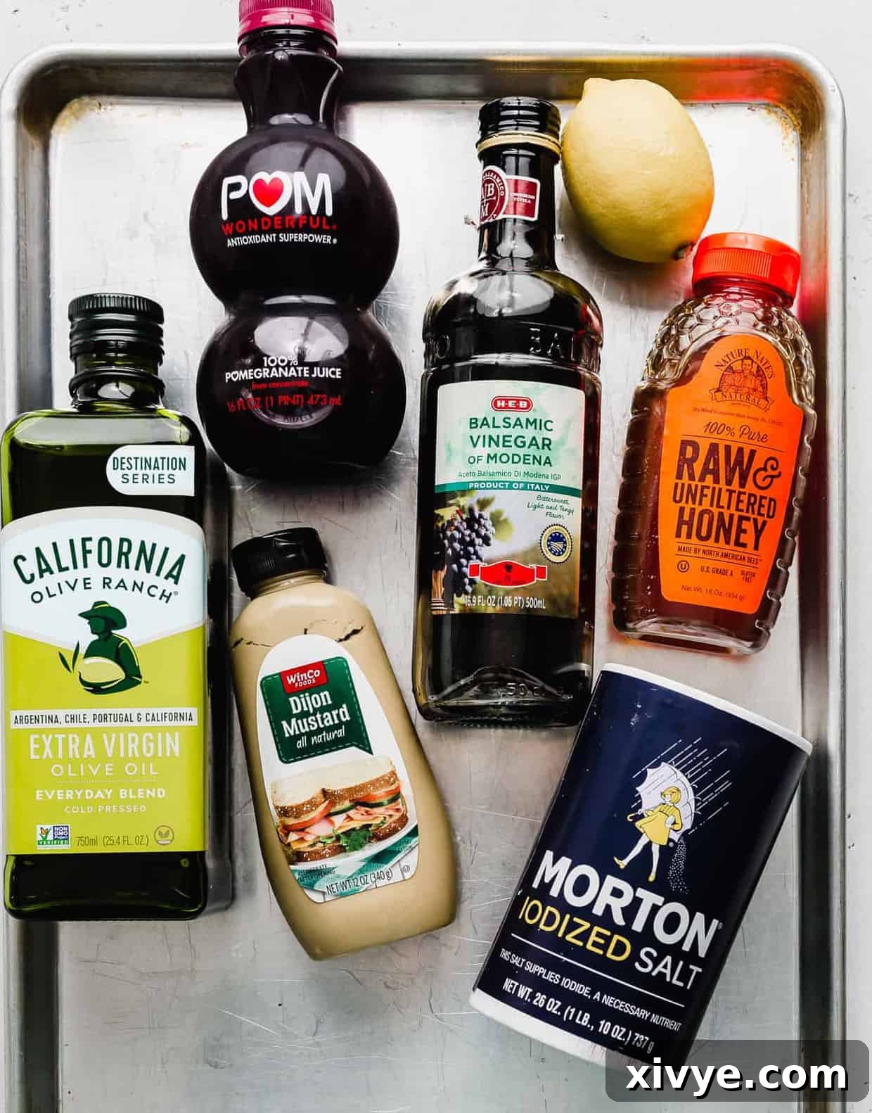 A collection of fresh ingredients laid out on a baking sheet, ready to be prepared for a delicious pomegranate salad.