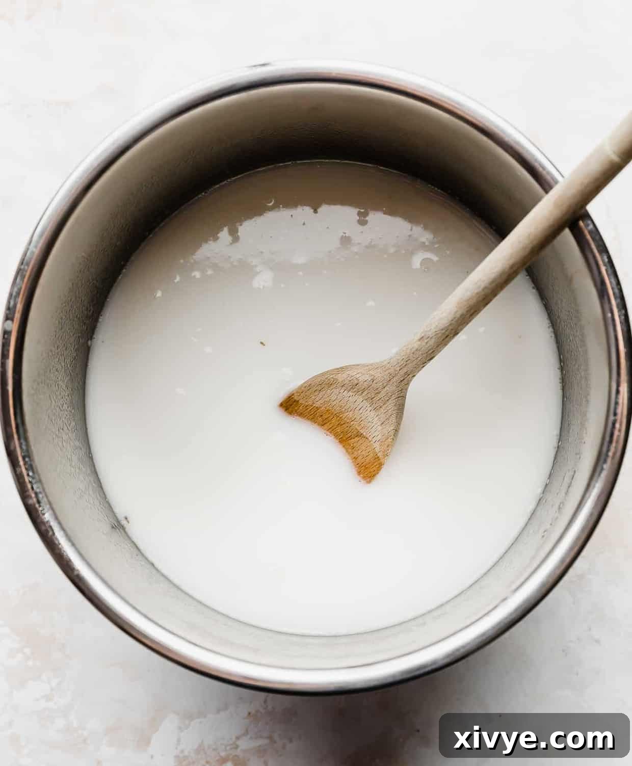 The Perfect Steel Cut Oats 6 The bowl of an instant pot full of steel cut oats, milk, and water (prior to cooking).
