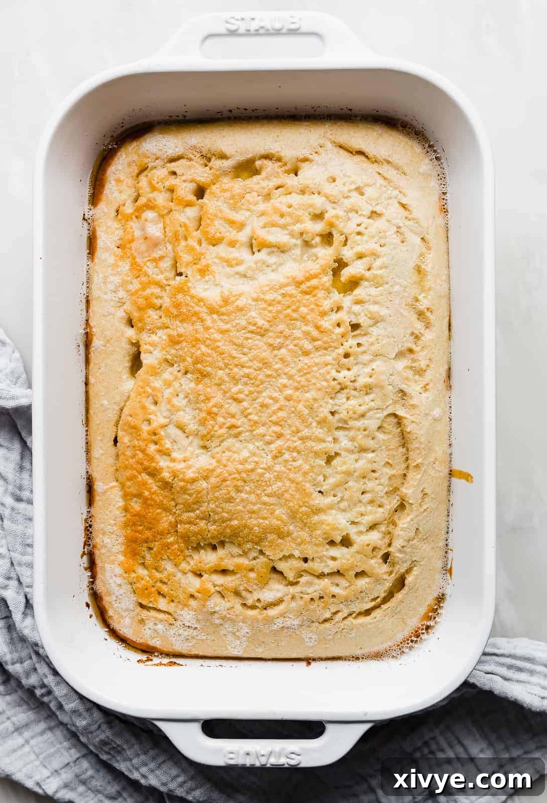 Wholesome German Pancake Delight 6 A casserole dish with fluffy baked Healthy German Pancake in it.