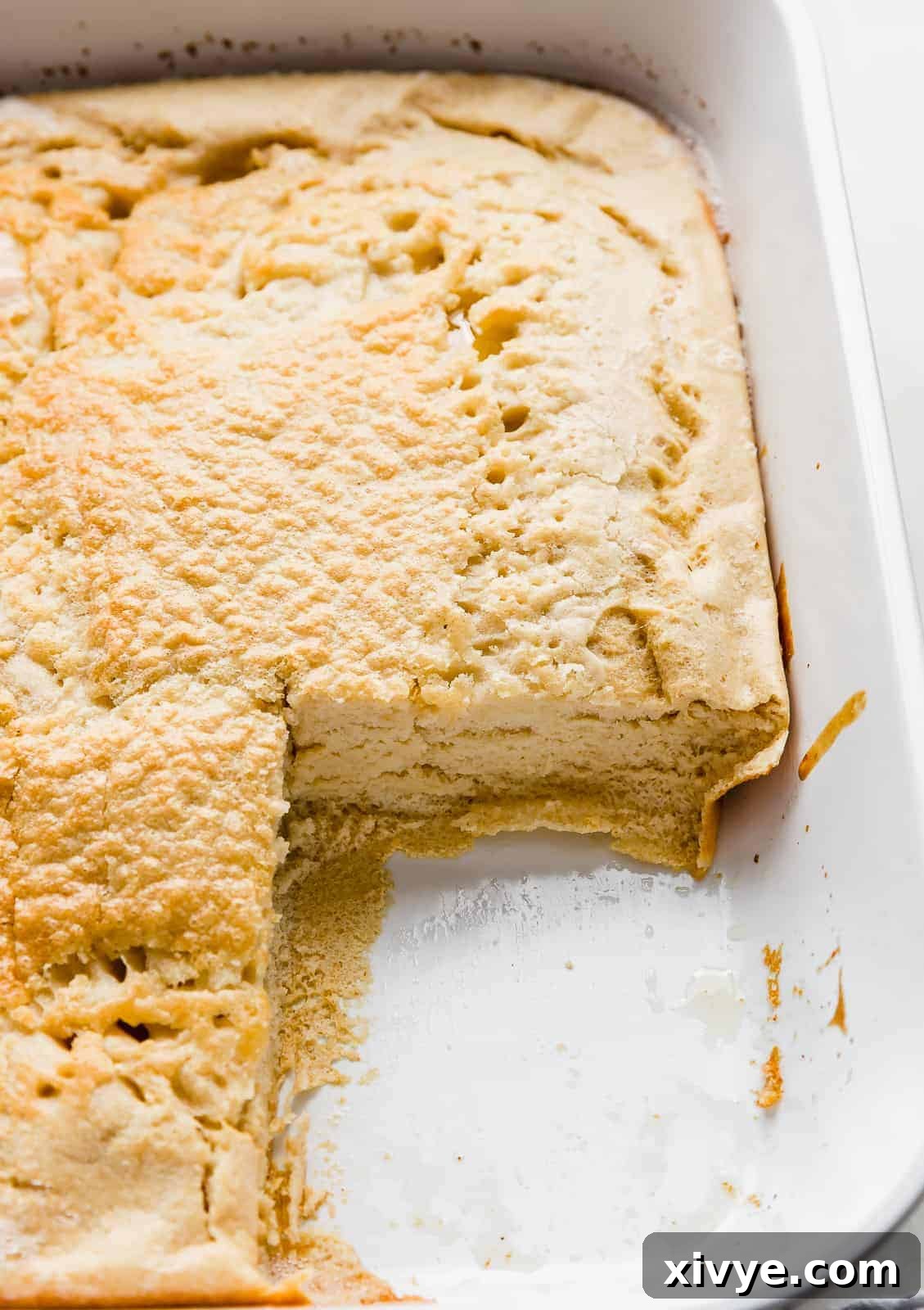 Wholesome German Pancake Delight 7 A slice of German pancake removed from the baking dish, showcasing a super fluffy pancake!