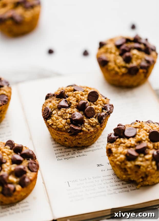 Kickstart Your Meals Week One 2 A few pumpkin baked oatmeal cups sitting on an open book.