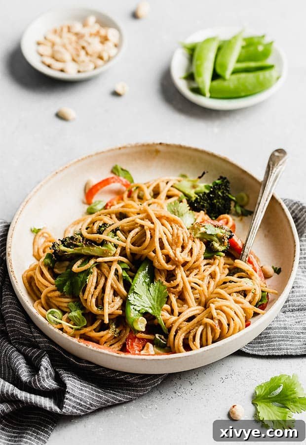 Kickstart Your Meals Week One 5 A plate of Peanut Noodles with veggies against a white background.