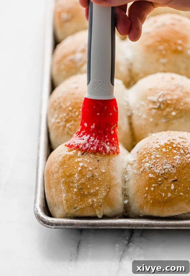 Rosemary Garlic and Parmesan Dinner Rolls on a serving platter.