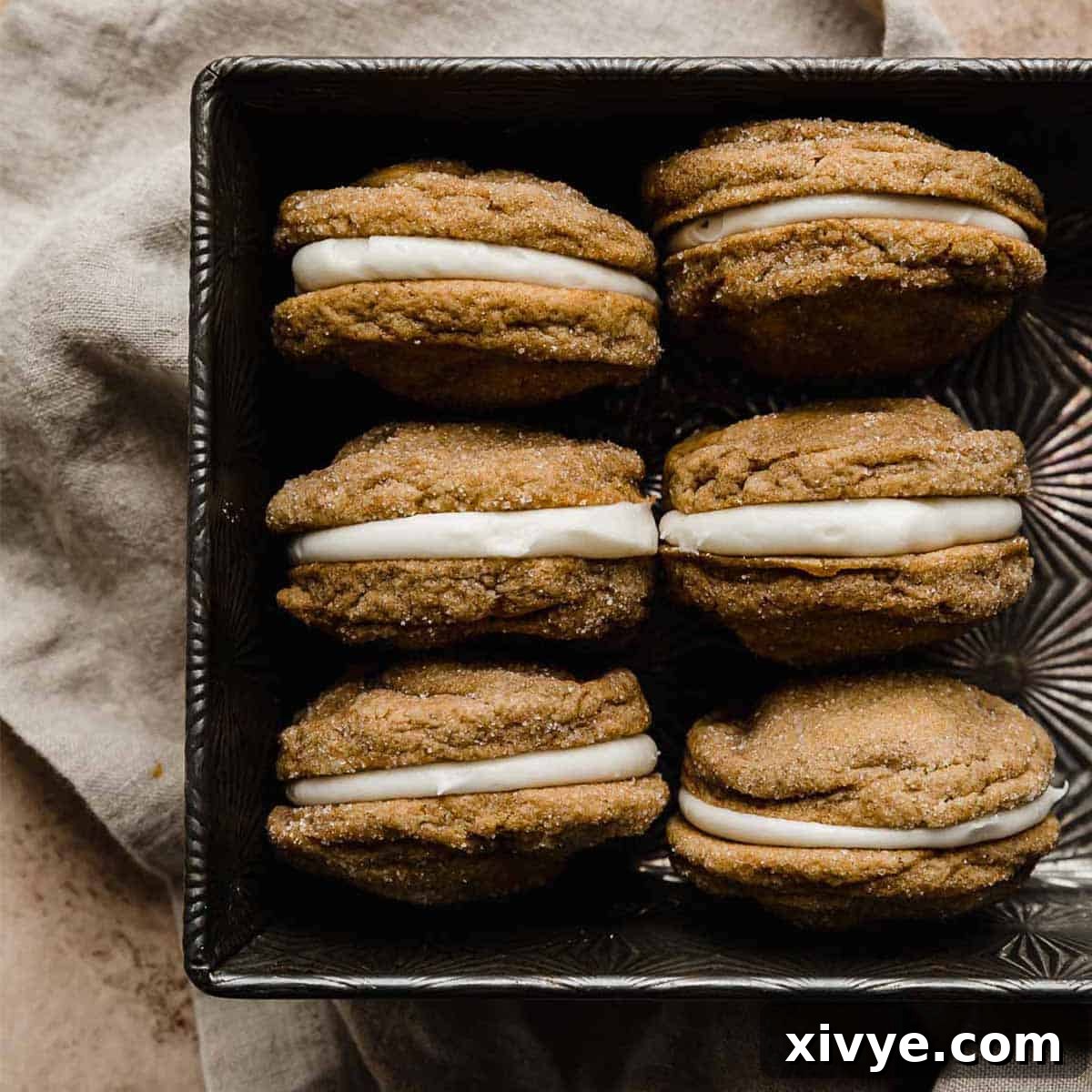 Festive Cookie Favorites Collection 7 Six gingerbread sandwich cookies (gingerbread whoopie pies) with cream cheese filling, stacked.