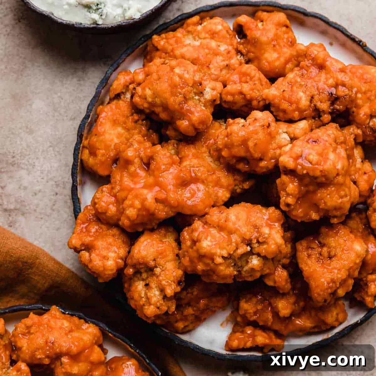Buffalo Chicken Bites on a black plate.