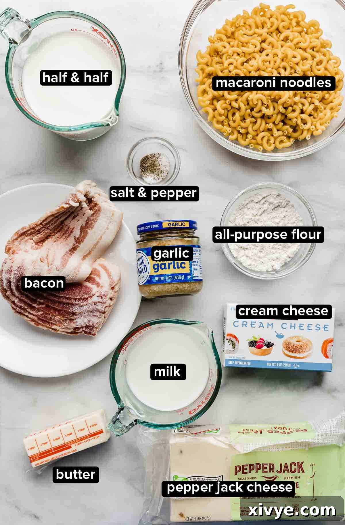 Spicy Pepper Jack Macaroni 3 Pepper Jack Mac and Cheese ingredients portioned into glass bowls on a white background.