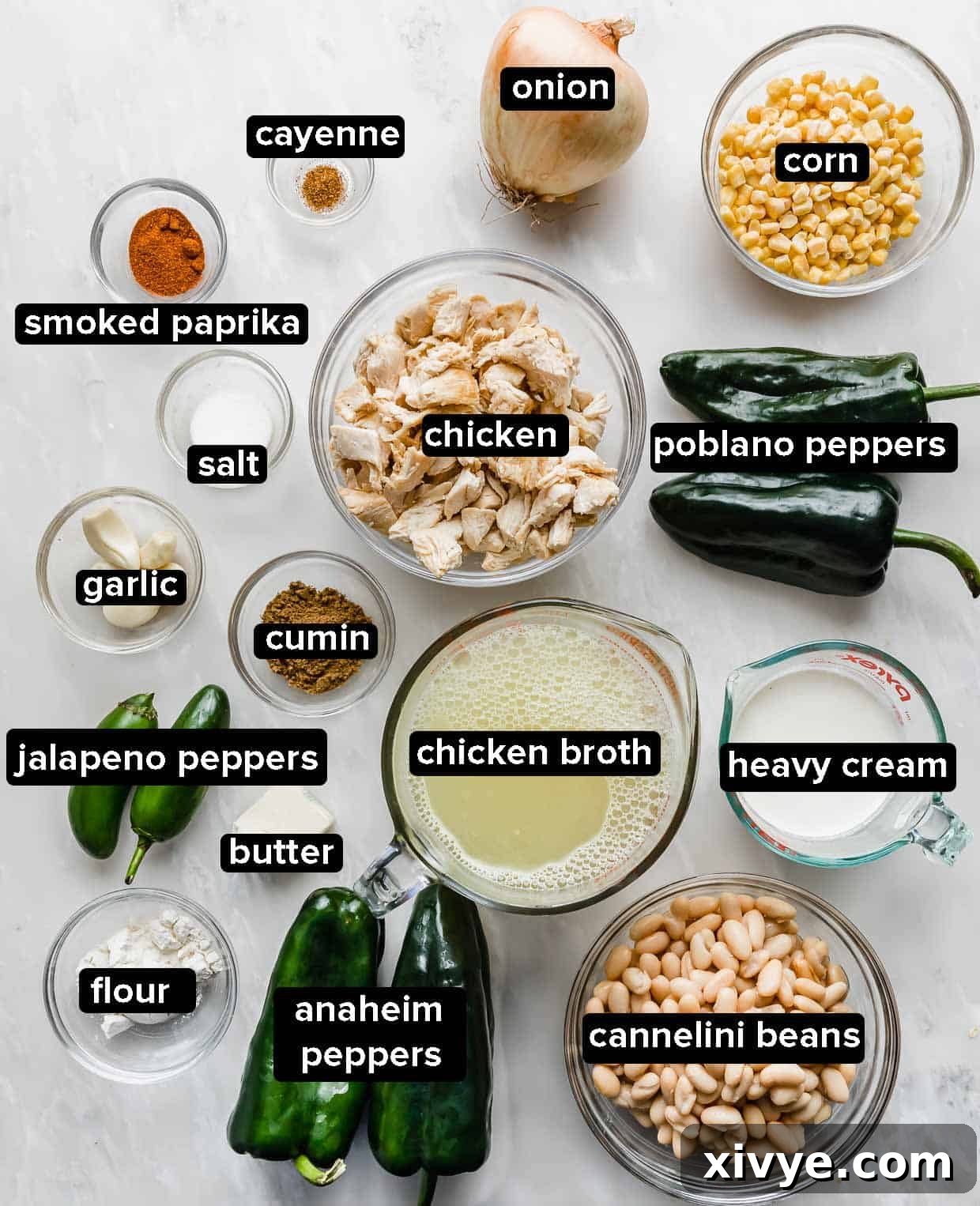 Creamy White Chicken Chili 3 All the fresh and dry ingredients laid out on a white background, ready to make The Best White Chicken Chili Recipe.